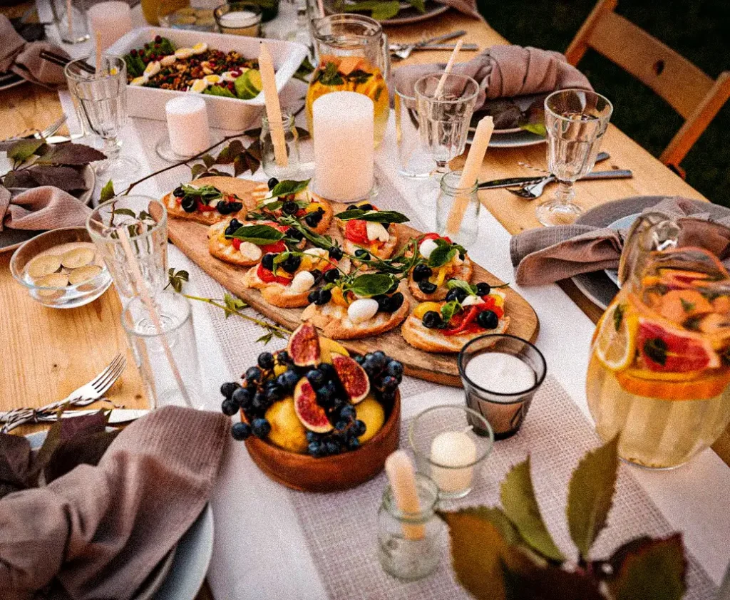 Shared dinner table with Italian cuisine at digital detox retreat in Puglia