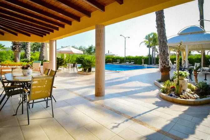 Outdoor dining terrace at countryside villa in Puglia southern Italy