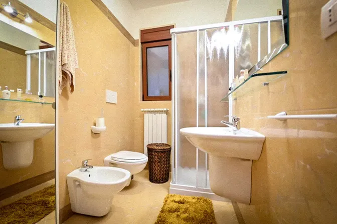 Italian bathroom featuring traditional ceramic tilework at countryside villa