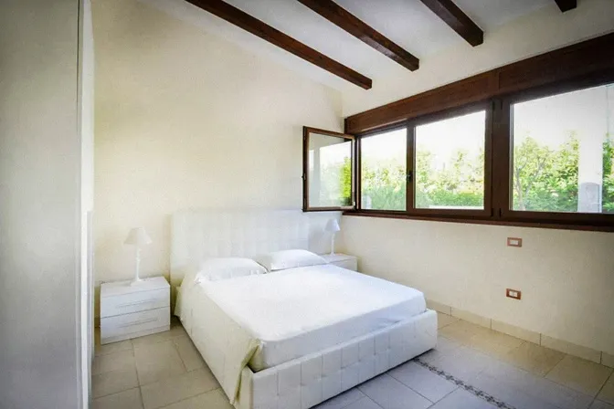 Quiet bedroom at digital detox retreat villa in southern Italy