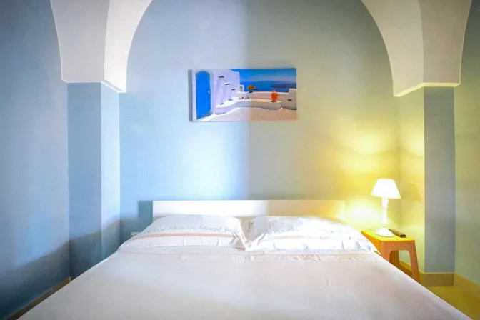 Bedroom with traditional vaulted ceiling at retreat villa in Puglia