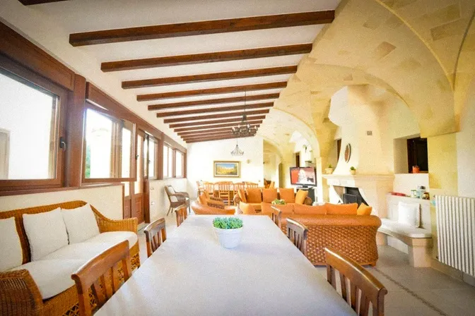 Long dining table for shared meals at countryside villa in Puglia Italy
